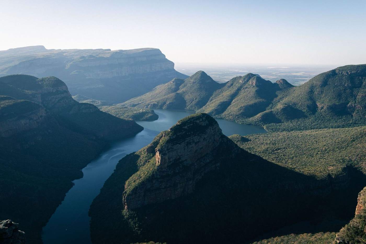 Blyde River Canyon with its river and the green domes of the Three Rondavels