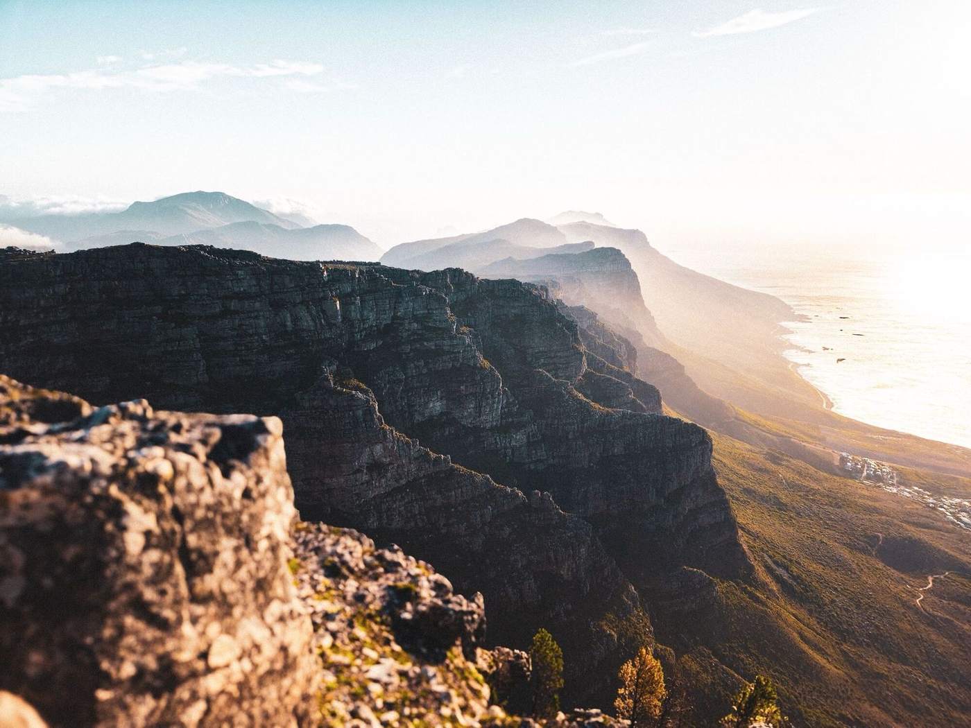 The cliffs of Table Mountain and the Twelve Apostles running down to the sea in soft light